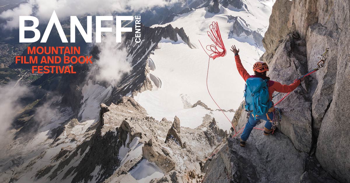 Mountain climber on a steep alpine rock face